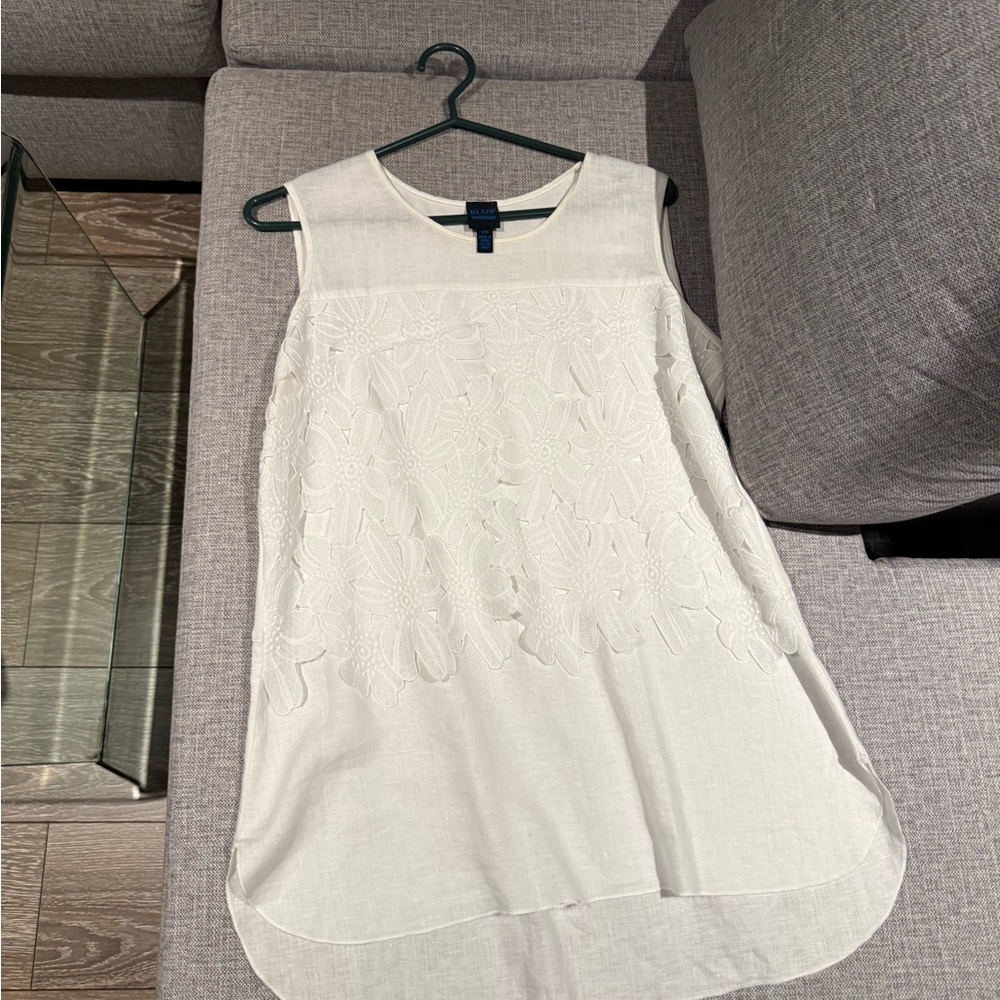 Chic Ivory Sleeveless Blouse
